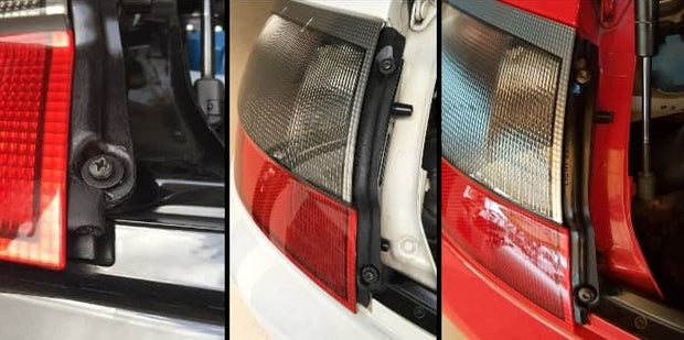 Gerissene Heckleuchtenbefestigung und eingebaute Stützstrebe am Porsche 996